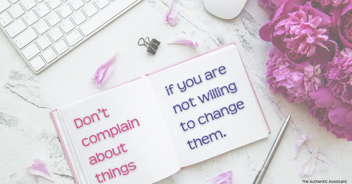 Aesthetic pink themed desk with a notebook and the caption " Don't complain about things if you are not willing to change them."