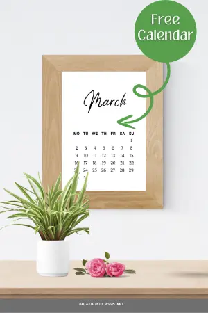 A framed display showing the free printable March calendar hung on the wall